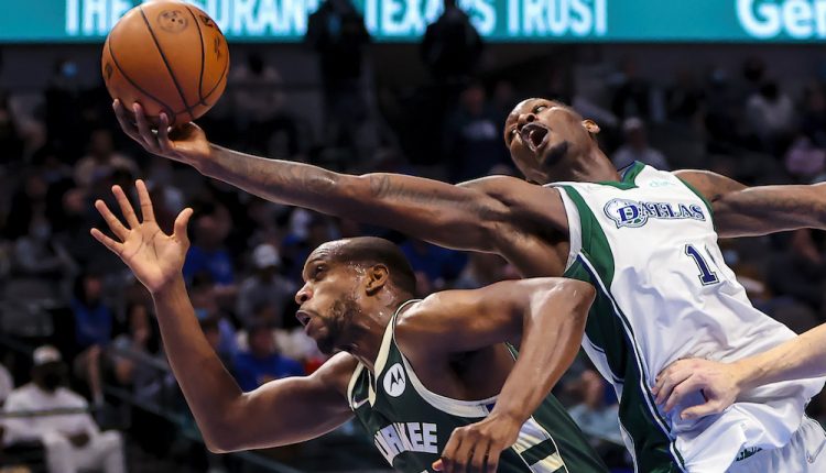 Dorian-Finney-Smith-Dallas-Mavericks-10-grabs-ball-from-Khris-Middleton-Milwaukee-Bucks-22-American-Airlines-Centre-Dallas-Texas-NBA.-©-Kevin-Jairaj